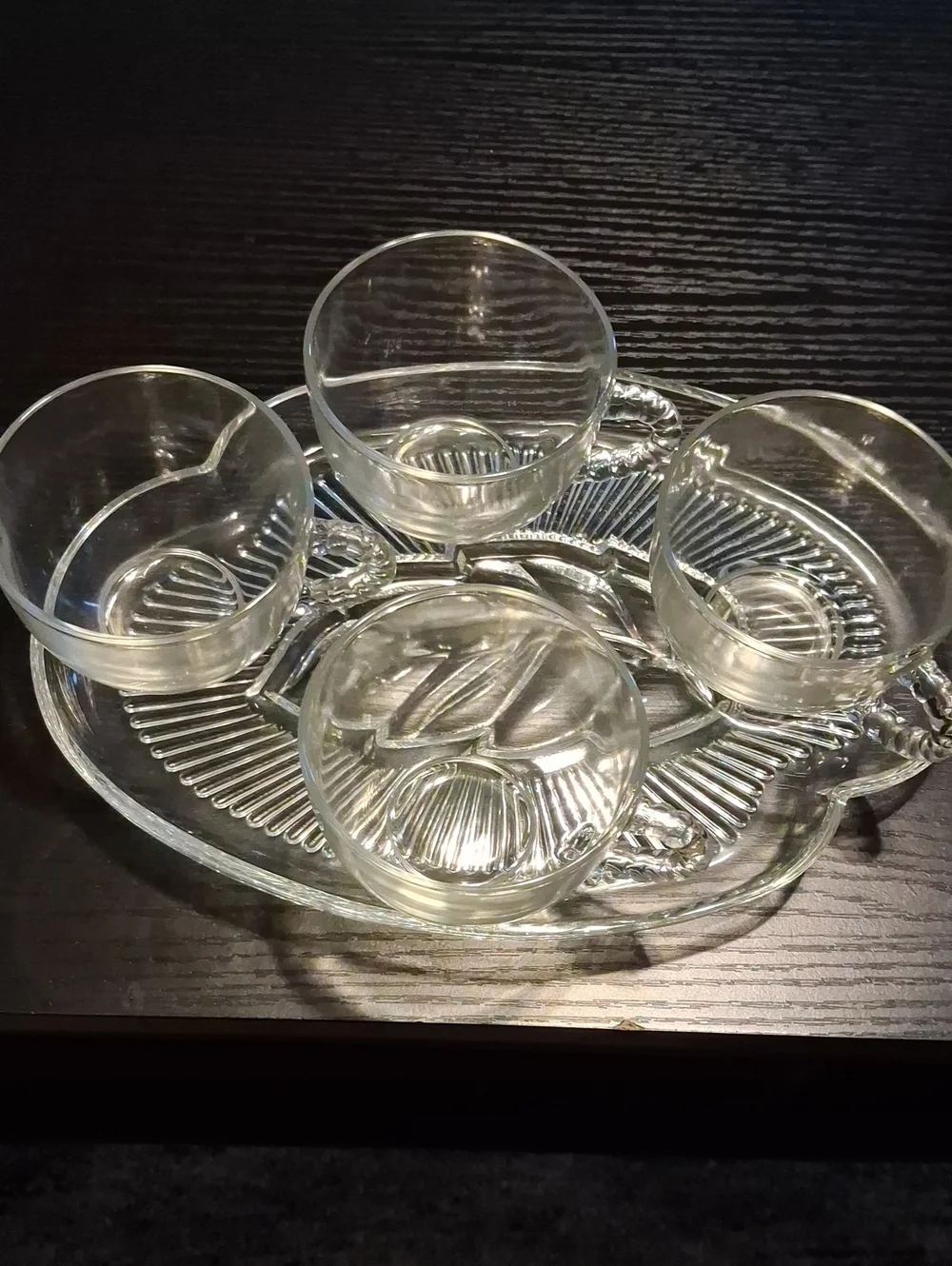 Four Glass Plates And Four Glass Cups
